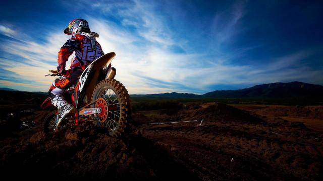 Dirt bike riding sunset mountain free wallpaper for desktop - medium preview image