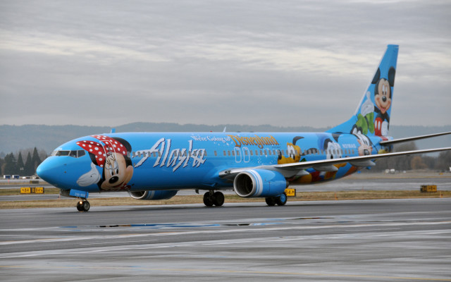 Blue airplane mickey runway mountains free wallpaper for desktop - medium preview image