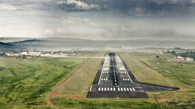 Runway plane field mountains cloudy free wallpaper for desktop - medium preview image