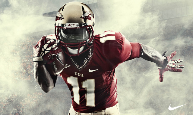 Football player uniform holding ball #3 free wallpaper for desktop - medium preview image