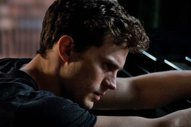 Man playing piano dark room free wallpaper for desktop - medium preview image