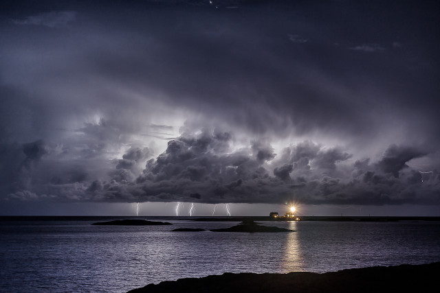 Storm coming water lighthouse distance free wallpaper for desktop - medium preview image