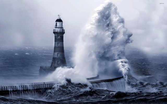 Lighthouse large wave crashing ocean free wallpaper for desktop - medium preview image