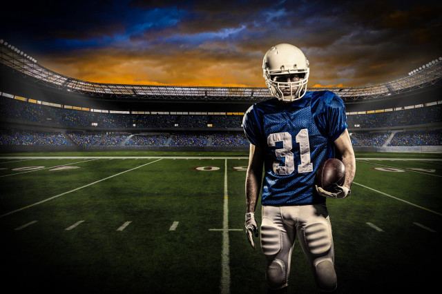 Football player night stadium dramatic free wallpaper for desktop - medium preview image