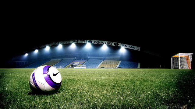 Soccer ball lush green field #3 free wallpaper for desktop - medium preview image