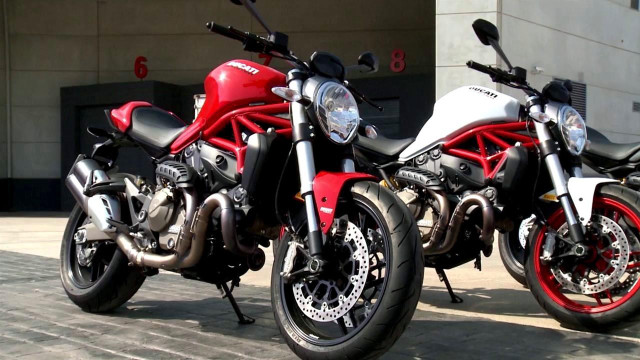 Motorcycles parked street building door free wallpaper for desktop - medium preview image