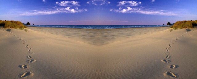 Beach footprints ocean blue sky free wallpaper for desktop - medium preview image