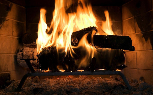 Fireplace burning metal frame logs free wallpaper for desktop - medium preview image
