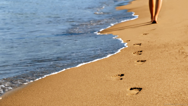 Beach footprints person walking water free wallpaper for desktop - medium preview image