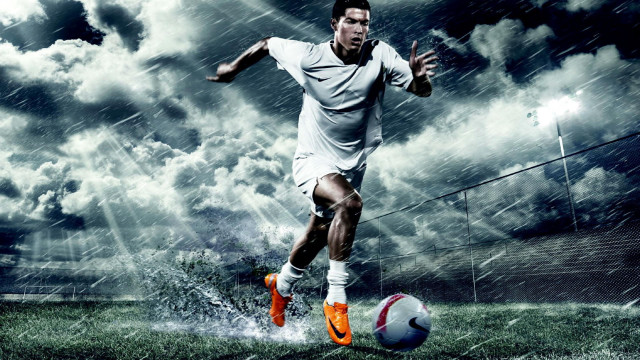 Man kicking soccer rainy cloudy free wallpaper for desktop - medium preview image