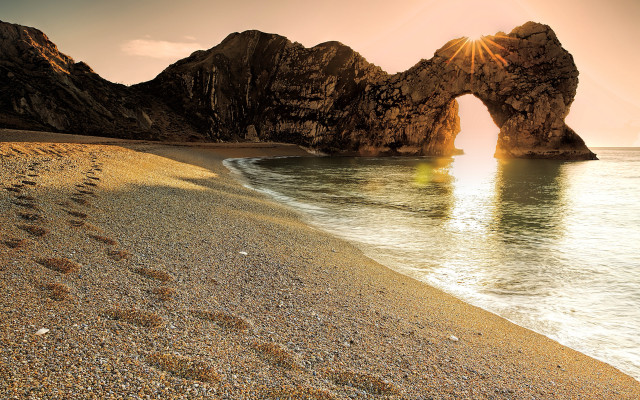 Beach rocks footprints sand water free wallpaper for desktop - medium preview image