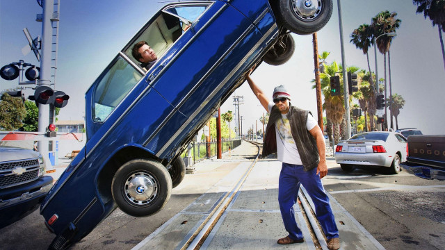 Man holding car upside down free wallpaper for desktop - medium preview image