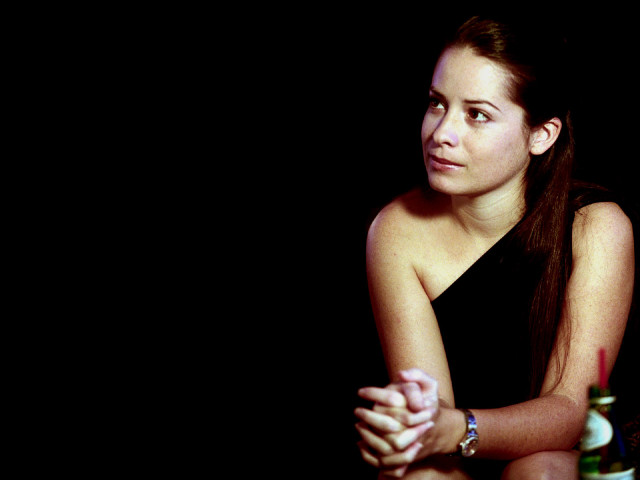 Woman sitting table wine bottle free wallpaper for desktop - medium preview image