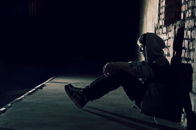 Person sitting ledged dark backpack free wallpaper for desktop - medium preview image