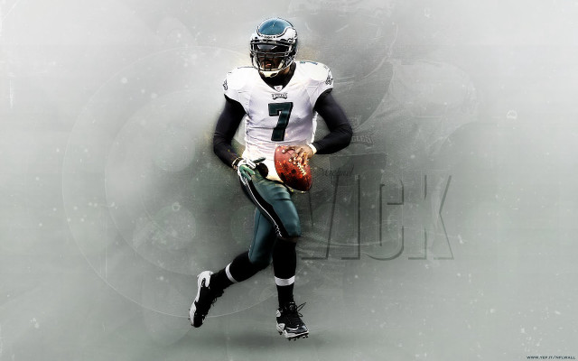 Football player holding ball running free wallpaper for desktop - medium preview image
