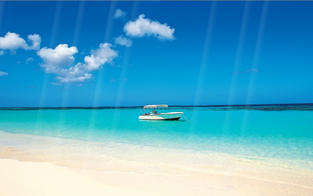 Boat beach ocean blue sky free wallpaper for desktop - medium preview image