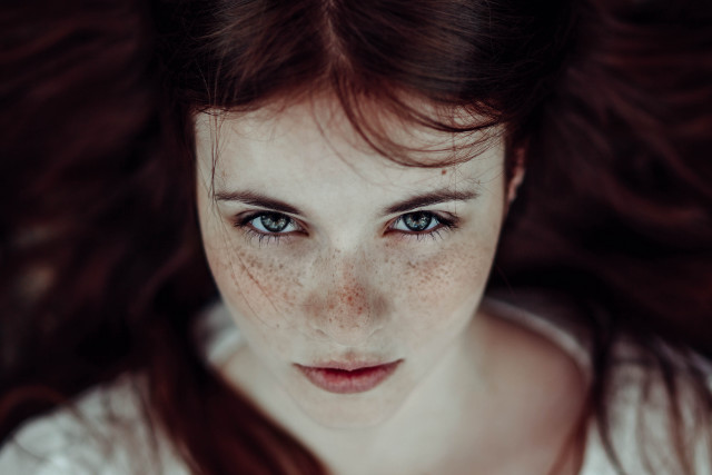 Woman freckles hair camera looking free wallpaper for desktop - medium preview image