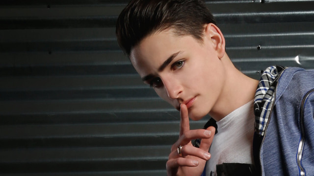 Young man finger sign jacket free wallpaper for desktop - medium preview image