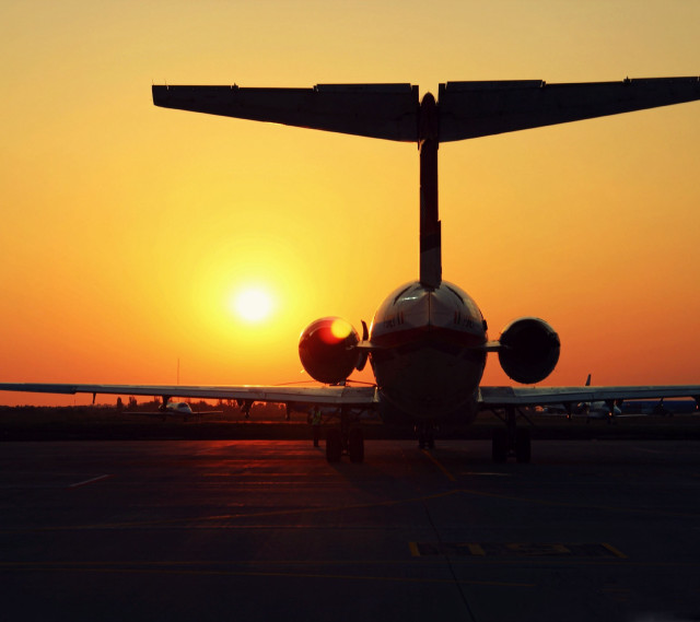 Plane sunset runway orange sky free wallpaper for tablet - medium preview image