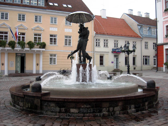 Statue woman umbrella fountain town free wallpaper for desktop - medium preview image