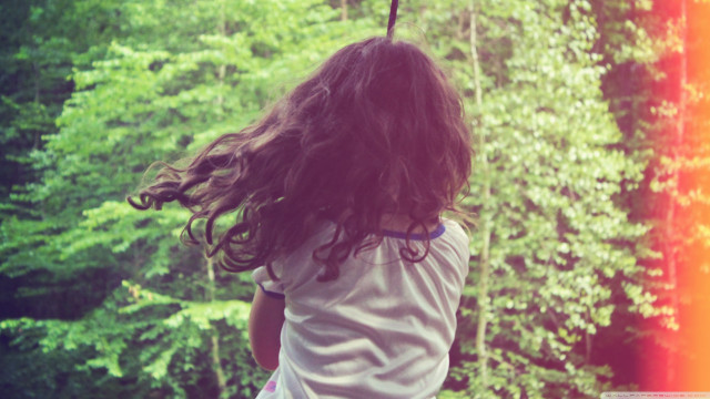 Little girl swinging rope forest free wallpaper for desktop - medium preview image