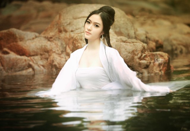 Woman white dress water rocks free wallpaper for desktop - medium preview image