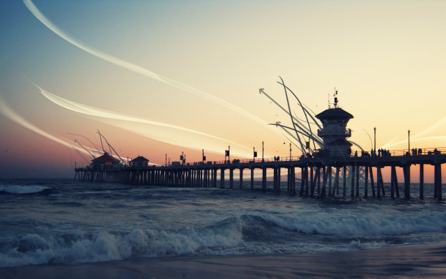 Pier clocktower sunset water contrails free wallpaper for desktop - medium preview image