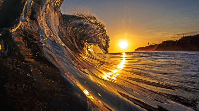 Sunset wave ocean sand rocks free wallpaper for desktop - medium preview image
