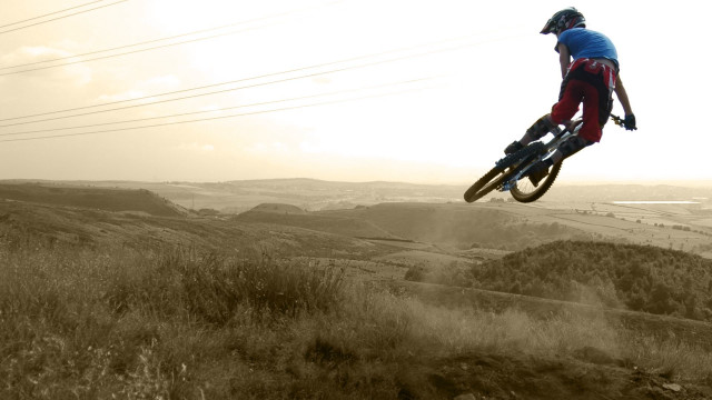 Man flying bike dirt road #2 free wallpaper for desktop - medium preview image