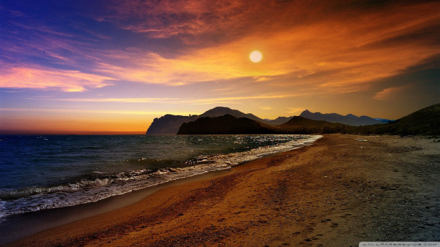 Beach sunset mountains water waves free wallpaper for desktop - medium preview image