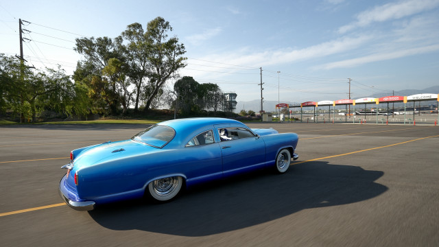 Blue car driving street parking free wallpaper for desktop - medium preview image