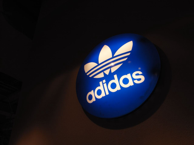 Blue adidas sign building night free wallpaper for desktop - medium preview image
