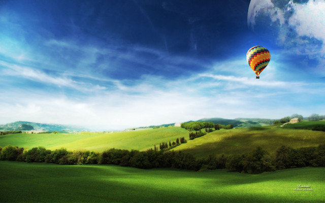 Hot air balloon over green free wallpaper for desktop - medium preview image
