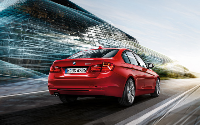 Red car driving street tall #2 free wallpaper for desktop - medium preview image