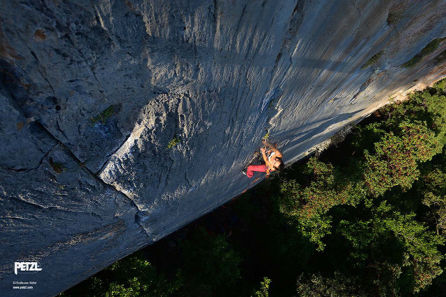 Man climbing steep cliff red free wallpaper for desktop - medium preview image