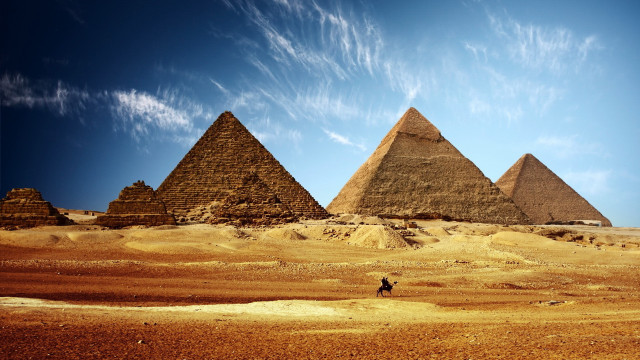 Pyramids desert sky person walking free wallpaper for desktop - medium preview image
