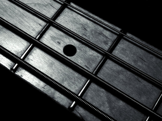 Guitar neck closeup black background #3 free wallpaper for desktop - medium preview image