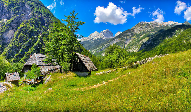 Grassy field mountain hut foreground free wallpaper for desktop - medium preview image