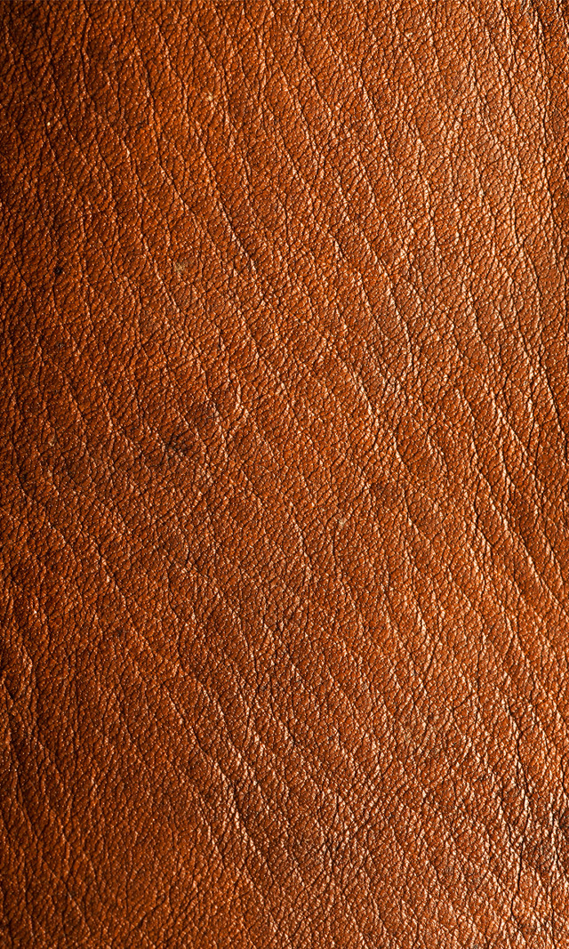 Brown leather textured surface scratches free wallpaper for mobile - medium preview image