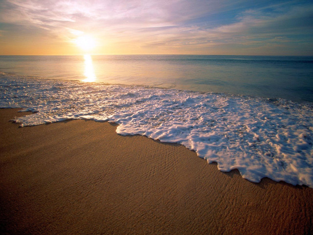 Beach waves sunset distant water free wallpaper for desktop - medium preview image