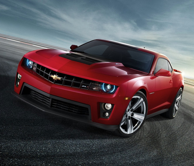 Red sports car driving cloudy #3 free wallpaper for desktop - medium preview image