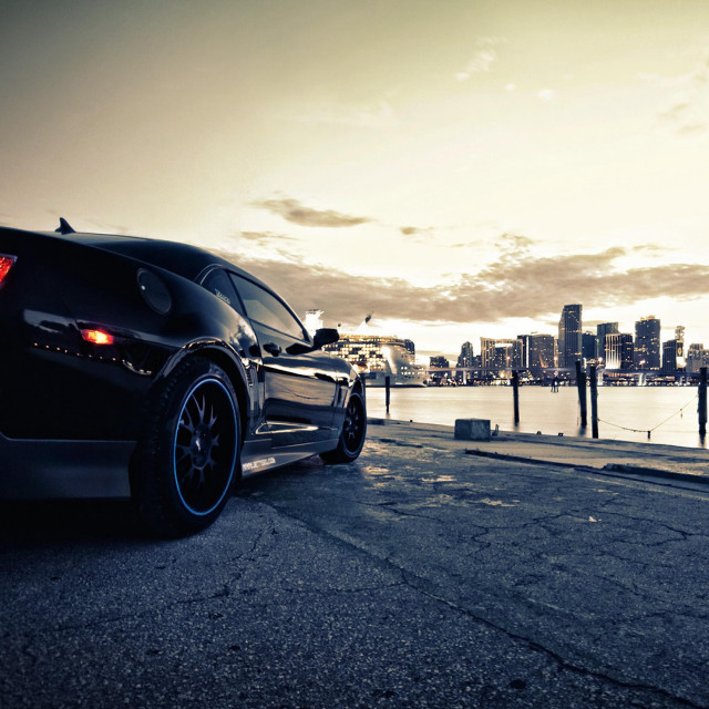 Black sports car water city free wallpaper for tablet - medium preview image