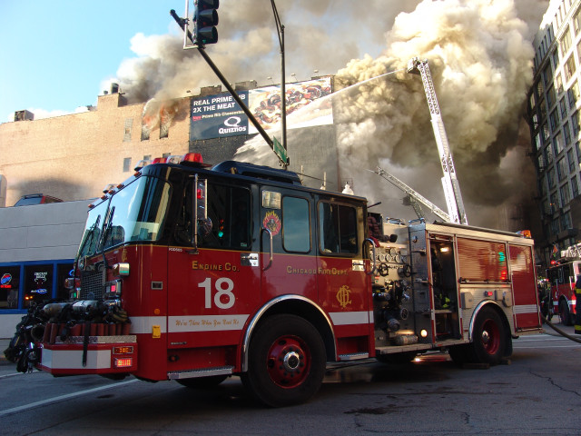 Fire truck driving smoke street free wallpaper for desktop - medium preview image