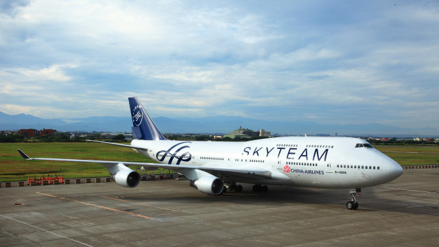 Skyteam airplane parked tarmac airport free wallpaper for desktop - medium preview image