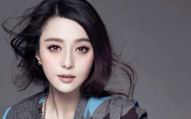 Woman necklace sweater pose hair free wallpaper for desktop - medium preview image