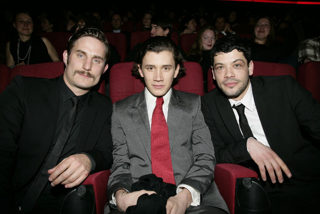 Two men suits theater arms free wallpaper for desktop - medium preview image