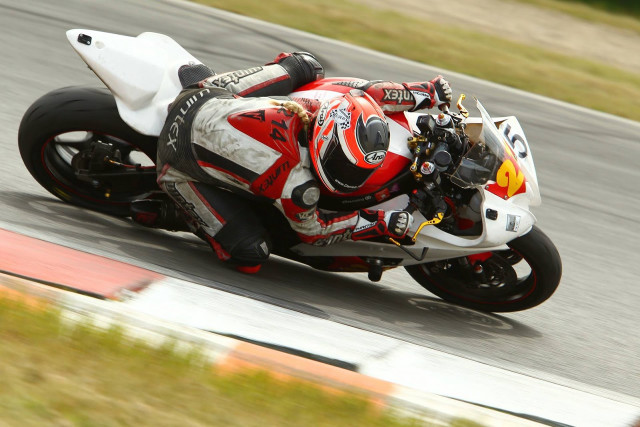 Motorcycle rider race track grass #2 free wallpaper for desktop - medium preview image