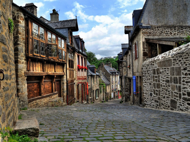 Cobblestone street stone building sign free wallpaper for desktop - medium preview image