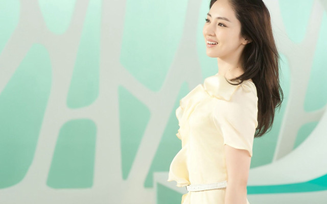 Woman yellow dress smiling wall #2 free wallpaper for desktop - medium preview image