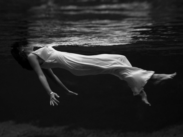 Woman floating water arms outstretched free wallpaper for desktop - medium preview image